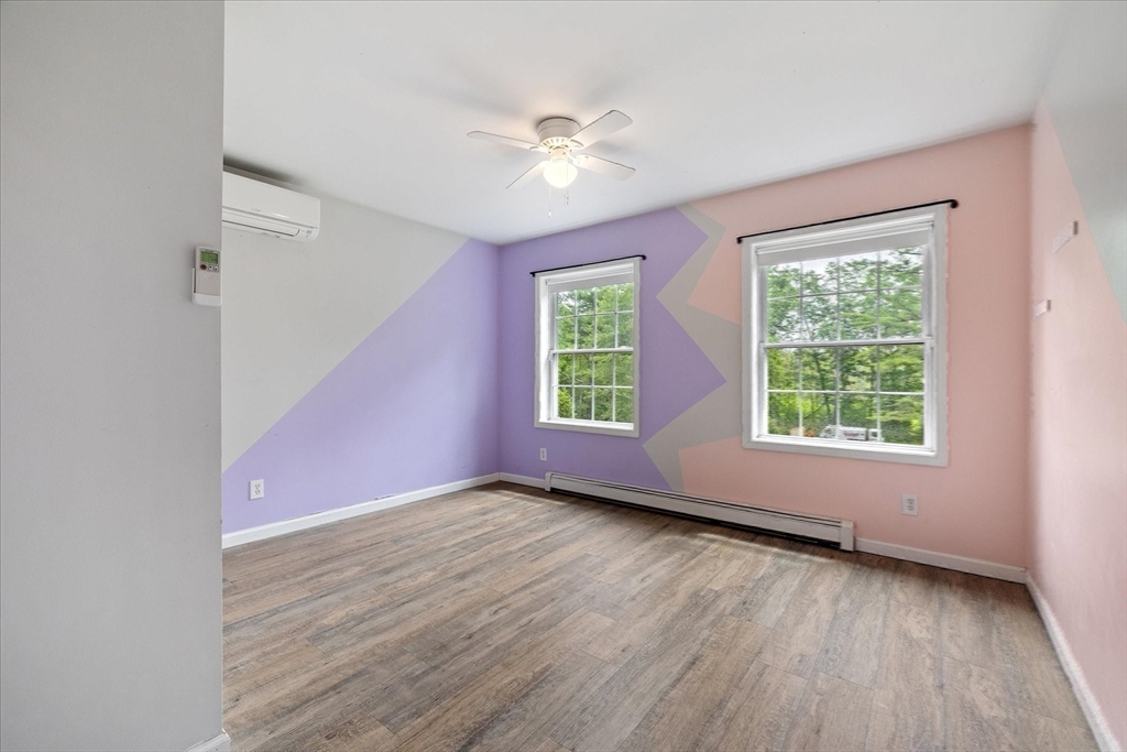 1824 Greenwich Road Hardwick, MA 01082 - Photo 28 of 41 a view of an empty room with wooden floor and a window
