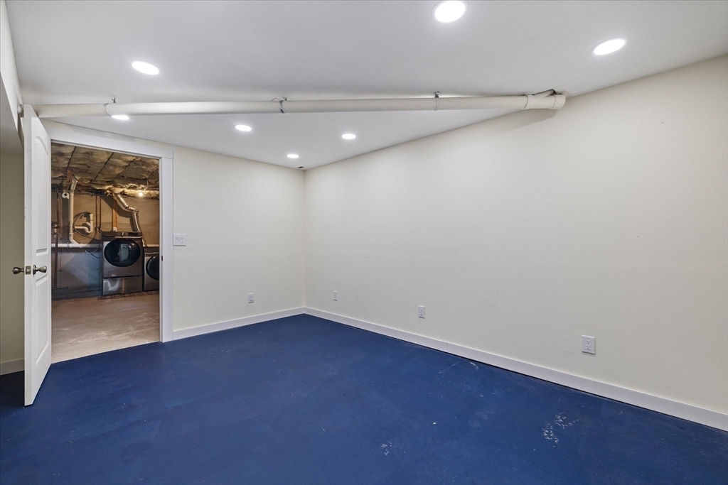 1824 Greenwich Road Hardwick, MA 01082 - Photo 41 of 41 an empty room with wooden floor and a bathroom