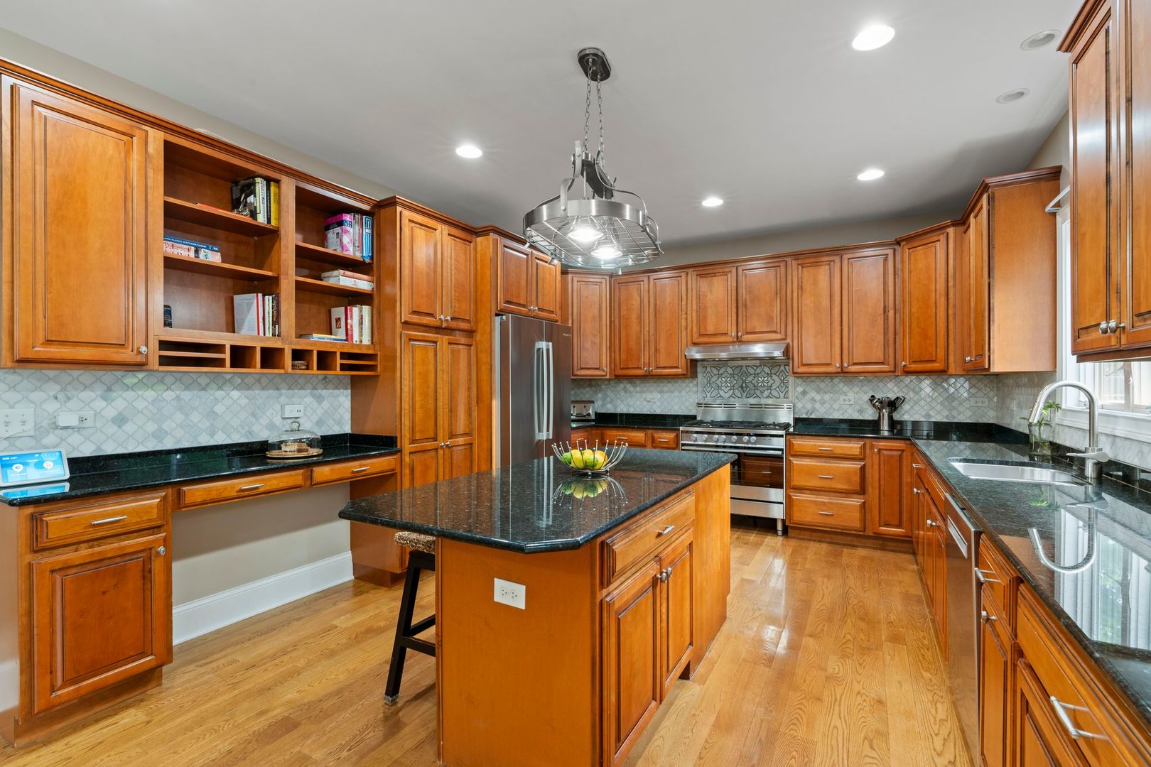 106 Forest View Drive Lake Bluff, IL 60044 - Photo 11 of 56 a kitchen with stainless steel appliances granite countertop a sink stove and refrigerator