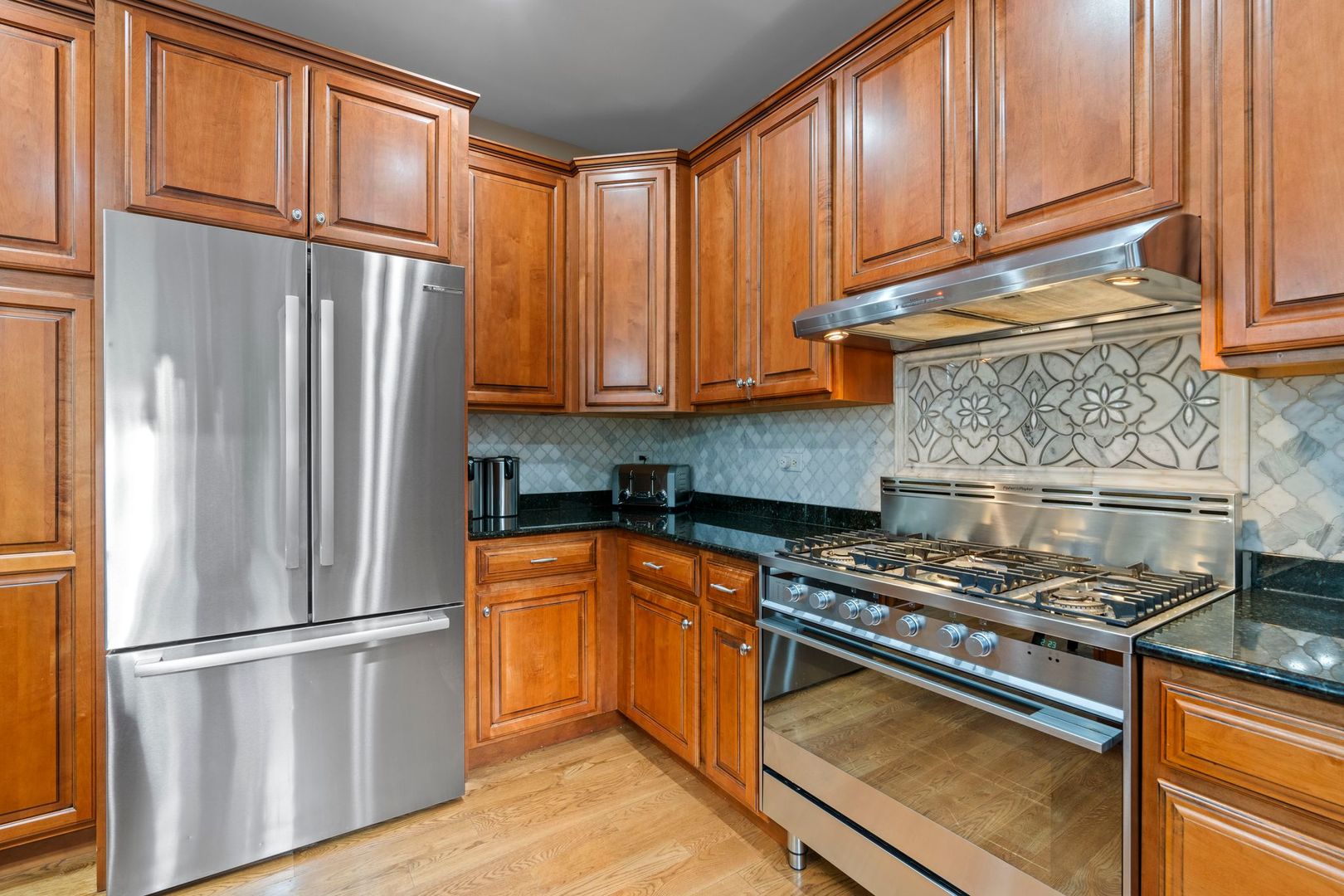 106 Forest View Drive Lake Bluff, IL 60044 - Photo 13 of 56 a kitchen with stainless steel appliances granite countertop a refrigerator sink and cabinets
