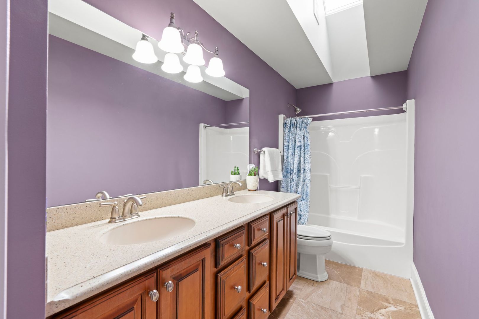 106 Forest View Drive Lake Bluff, IL 60044 - Photo 31 of 56 a bathroom with a granite countertop sink a toilet a mirror and shower