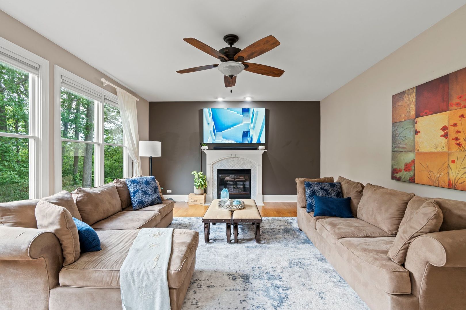 106 Forest View Drive Lake Bluff, IL 60044 - Photo 7 of 56 a living room with furniture a fireplace and a large window