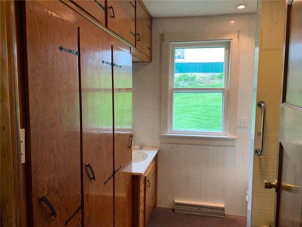 100 Main Street Home, PA 15747 - Photo 19 of 25 a bathroom with a shower and a window