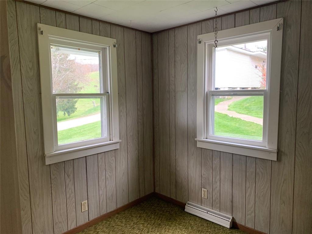 100 Main Street Home, PA 15747 - Photo 21 of 25 a view of an empty room with wooden floor and a window