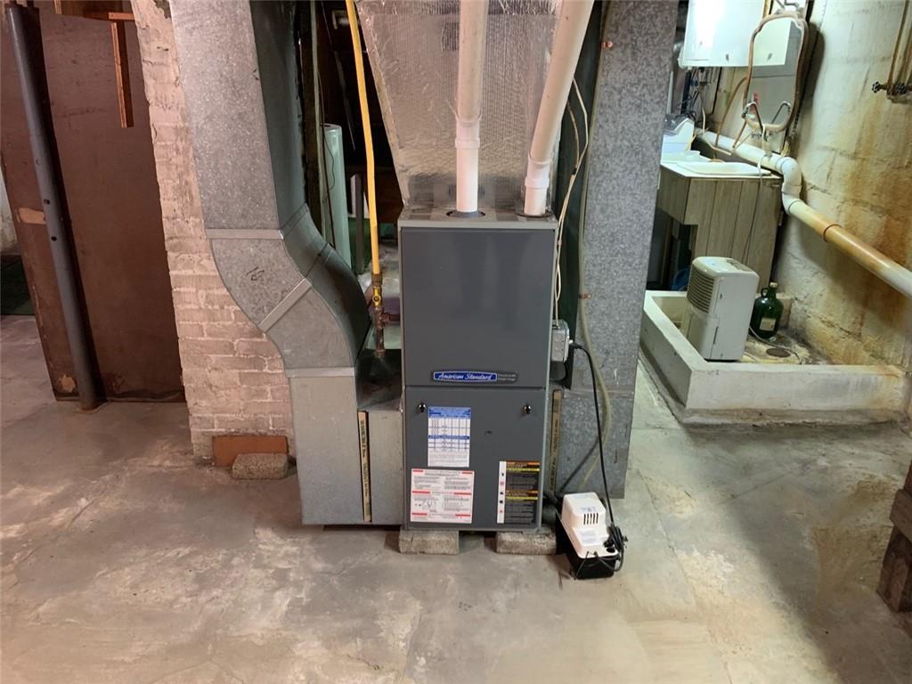 100 Main Street Home, PA 15747 - Photo 23 of 25 a living room with couch and a fireplace