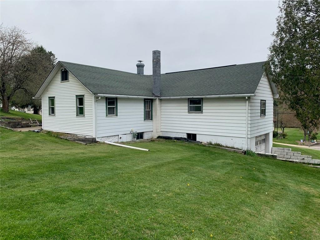 100 Main Street Home, PA 15747 - Photo 4 of 25 a front view of house with yard