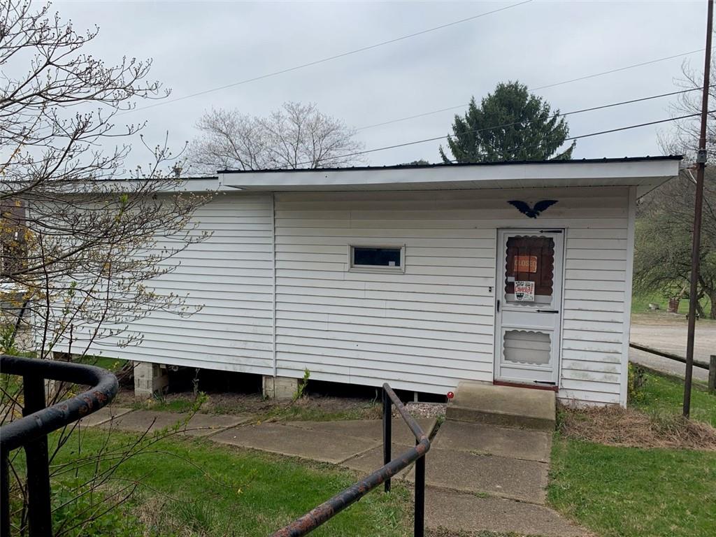 100 Main Street Home, PA 15747 - Photo 7 of 25 a view of a patio with table and chairs a barbeque with wooden fence