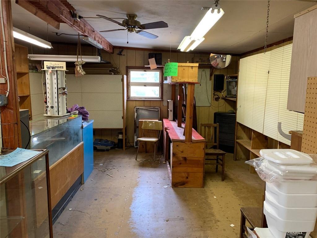 100 Main Street Home, PA 15747 - Photo 8 of 25 a kitchen with sink refrigerator and stove