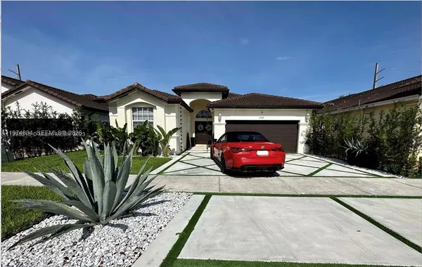 a view of a car in front of a building