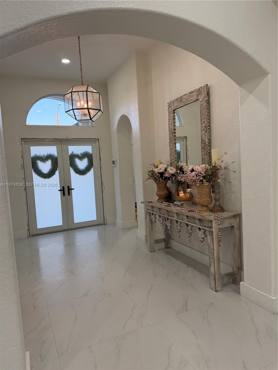 3744 Southwest 156th Court Miami, FL 33185 - Photo 2 of 13 a kitchen with stainless steel appliances granite countertop a sink and cabinets