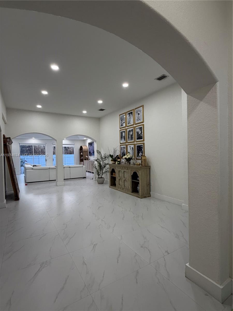 3744 Southwest 156th Court Miami, FL 33185 - Photo 4 of 13 a view of a livingroom with car and furniture