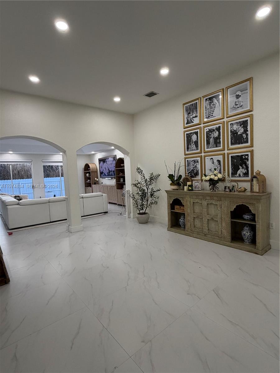3744 Southwest 156th Court Miami, FL 33185 - Photo 5 of 13 a living room with furniture and fireplace