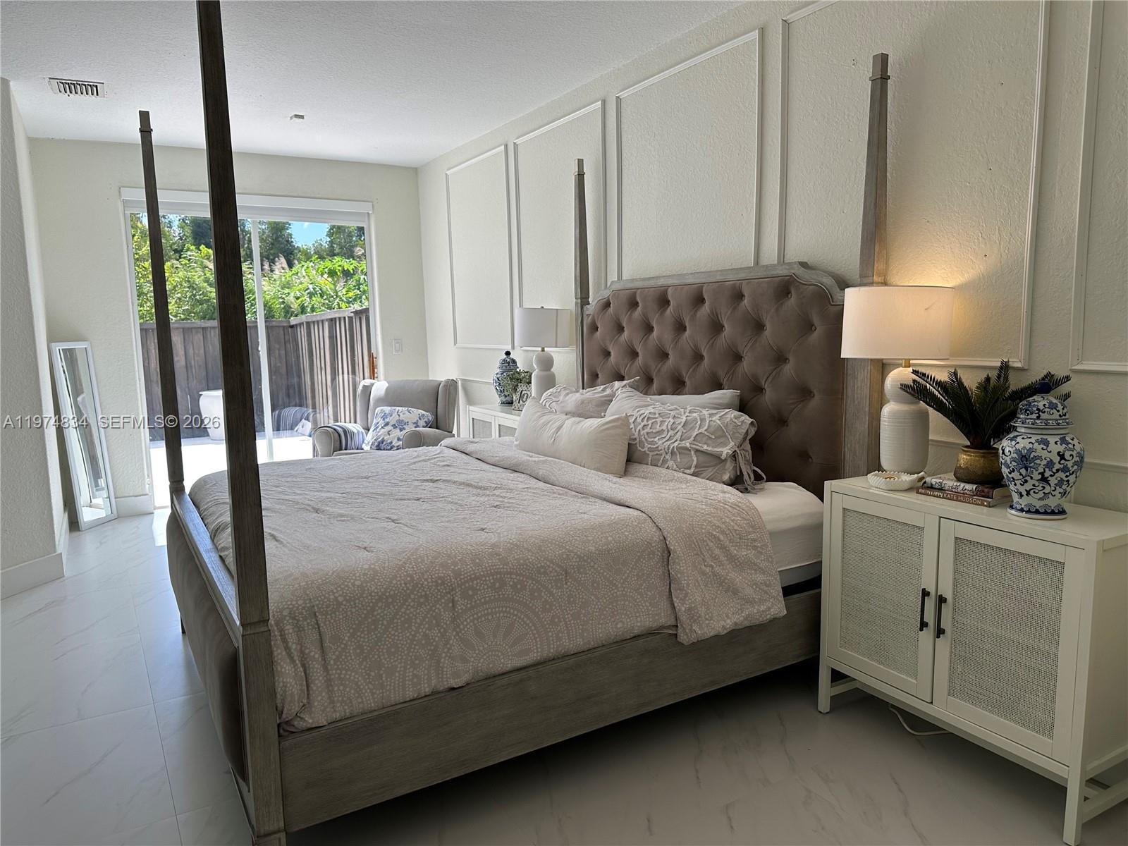 3744 Southwest 156th Court Miami, FL 33185 - Photo 10 of 13 a bedroom with a large bed and a window