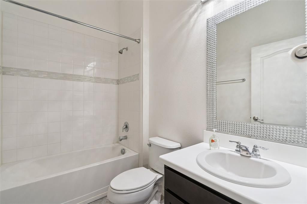 989 Maypole Drive Apopka, FL 32703 - Photo 18 of 39 a bathroom with a sink toilet and shower