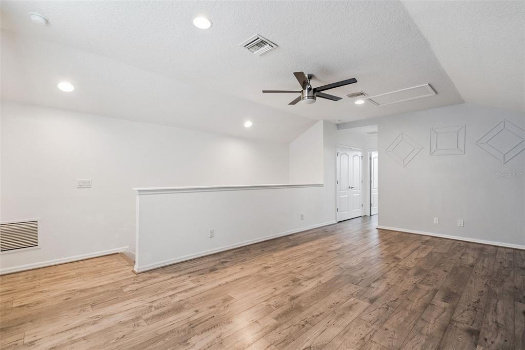 989 Maypole Drive Apopka, FL 32703 - Photo 20 of 39 an empty room with fan and windows