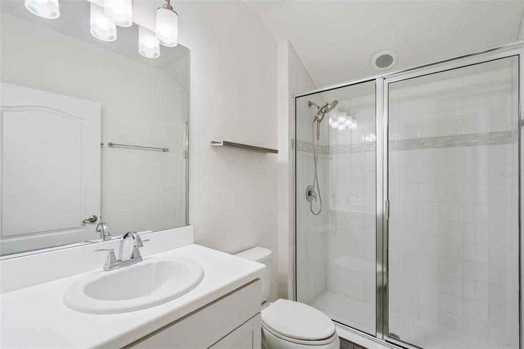 989 Maypole Drive Apopka, FL 32703 - Photo 25 of 39 a bathroom with a sink toilet and shower