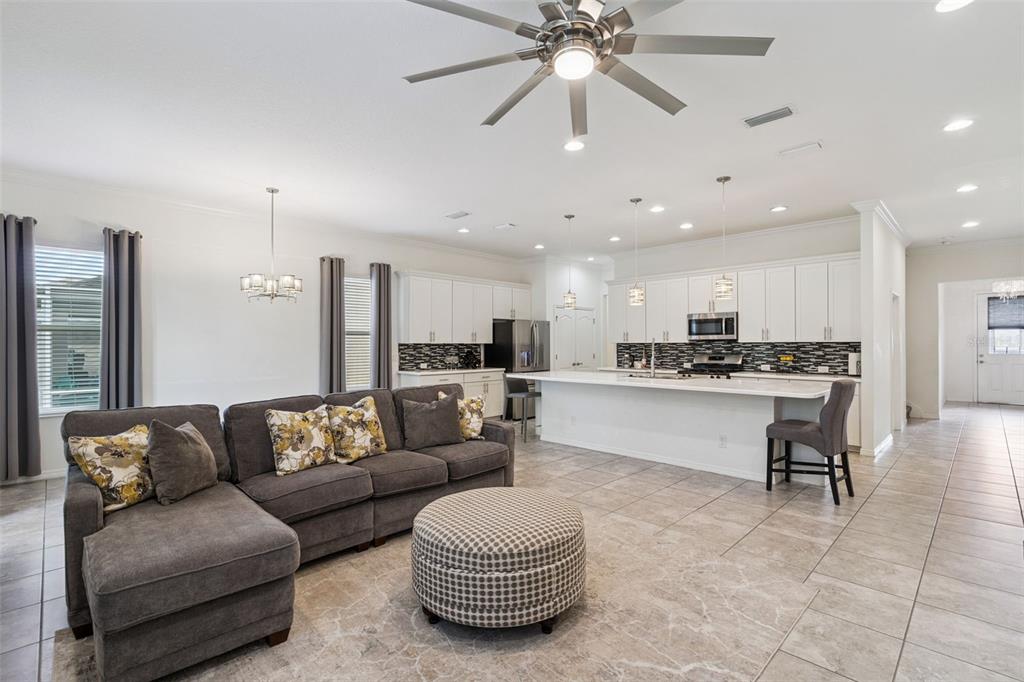 989 Maypole Drive Apopka, FL 32703 - Photo 4 of 39 a living room with furniture and kitchen view