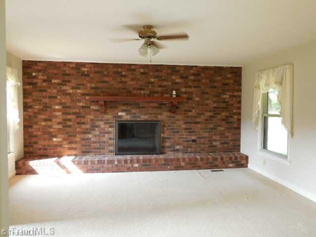 Den/Family/Great Room. The den has a fireplace with gas logs.