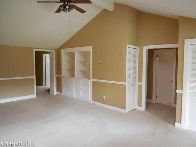 Living Room. The vaulted great room has built in cabinetry and skylight for bright natural light.