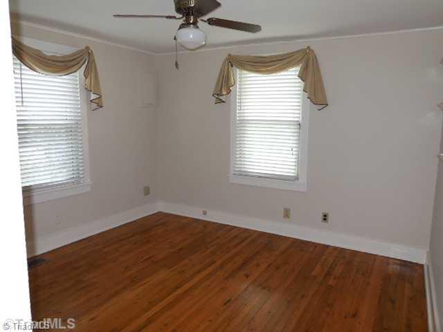 180 South Old Quarry Road Elkin, NC 28621 - Photo 8 of 16 2nd Bedroom. Beautiful hardwood floors in the 2 and 3rd bedrooms.