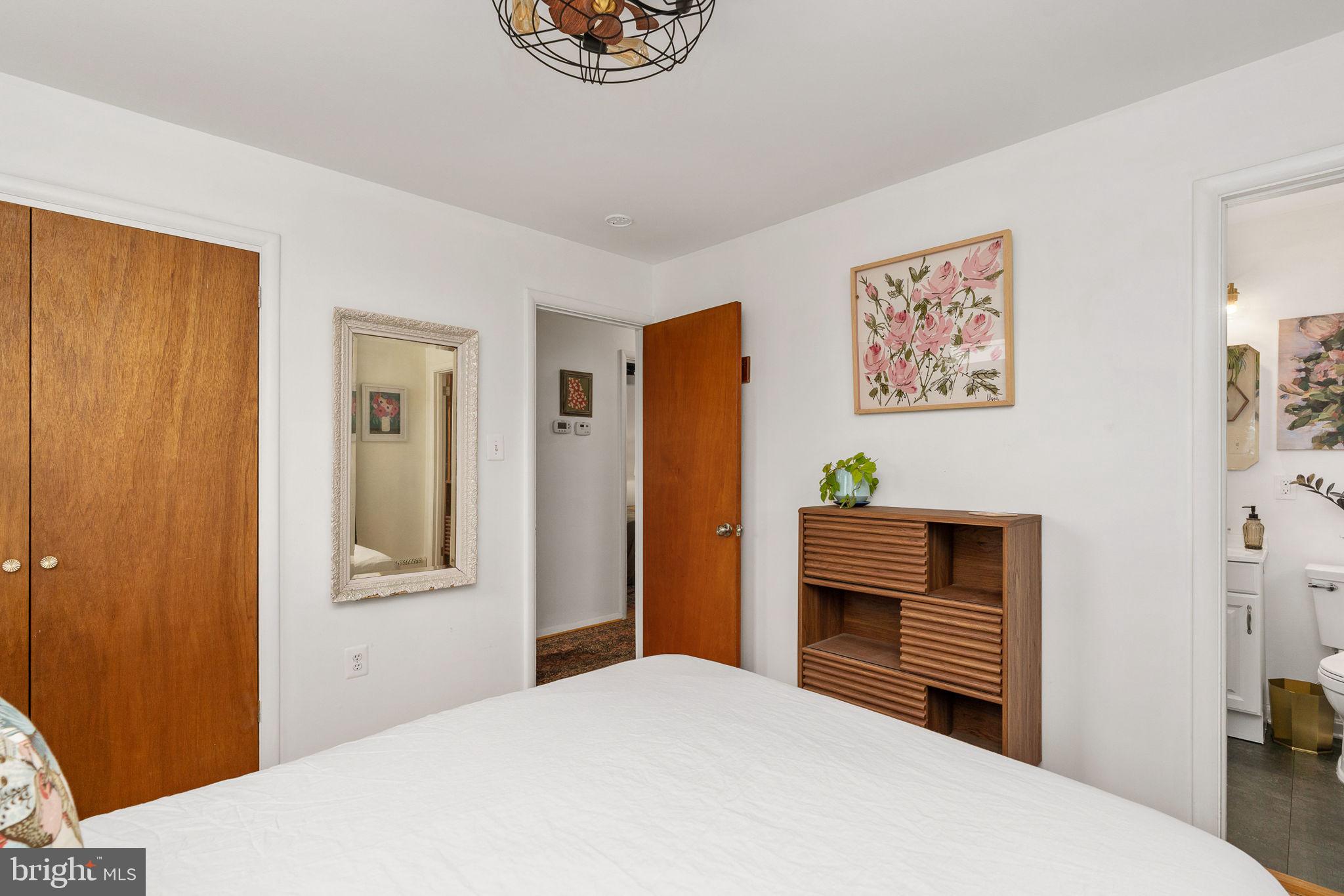 6714 Ruskin Street Springfield, VA 22150 - Photo 34 of 63 a bedroom with a bed and a television