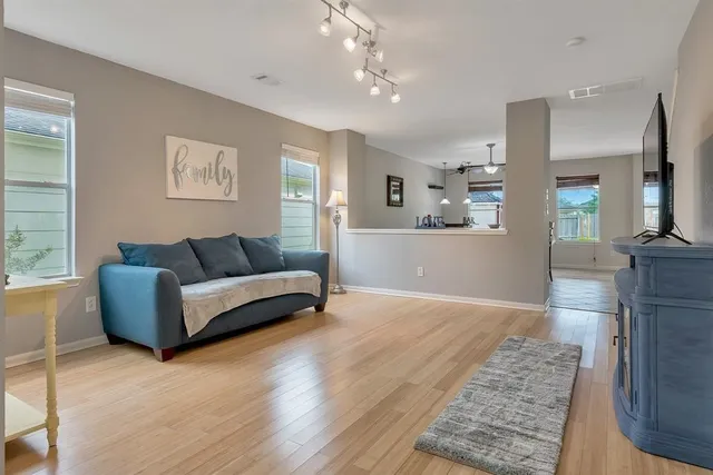 a living room with furniture and a rug