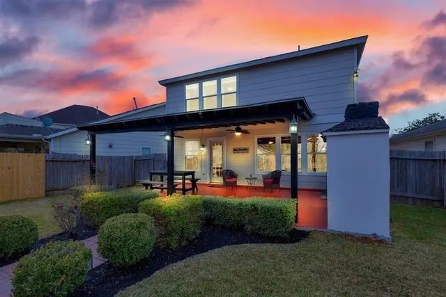 a front view of a house with a yard table and chairs