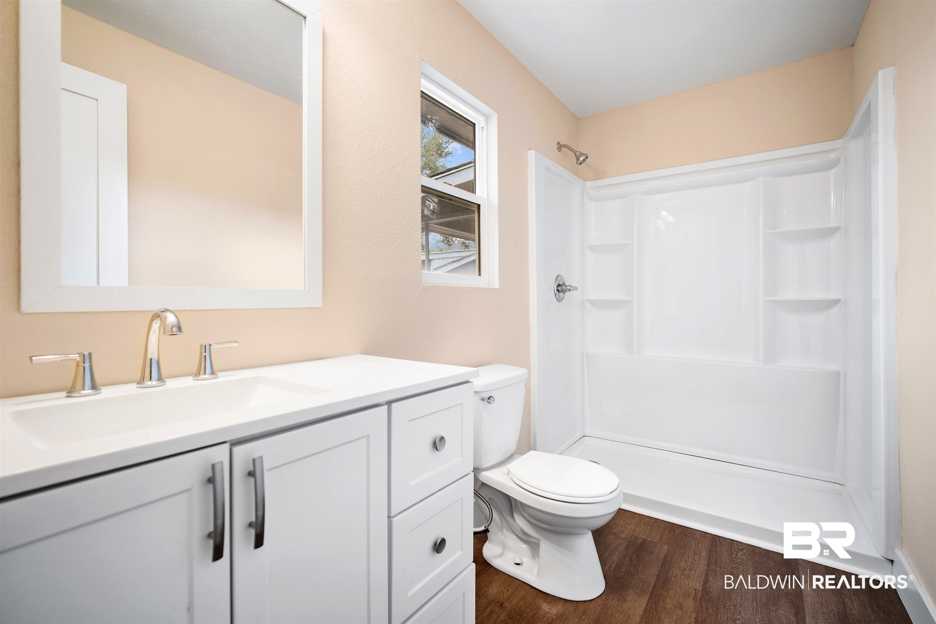 2119 Autrey Avenue Eight Mile, AL 36613 - Photo 13 of 22 Bathroom with vanity, wood-type flooring, walk in shower, and toilet