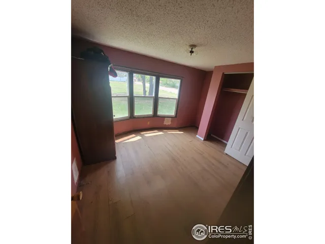 a view of an empty room with large window