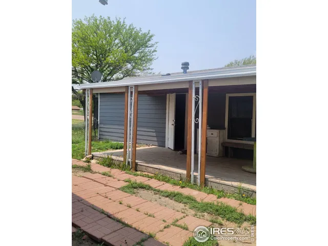 a view of house with backyard porch and entertaining space