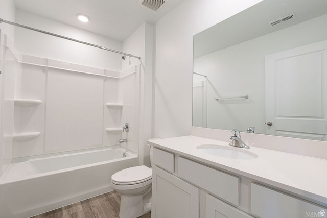 1693 Devils Gdn Lane Washington, UT 84780 - Photo 22 of 64 Bathroom featuring a white vanity with an integrated sink, polished chrome faucet, and a large mirror