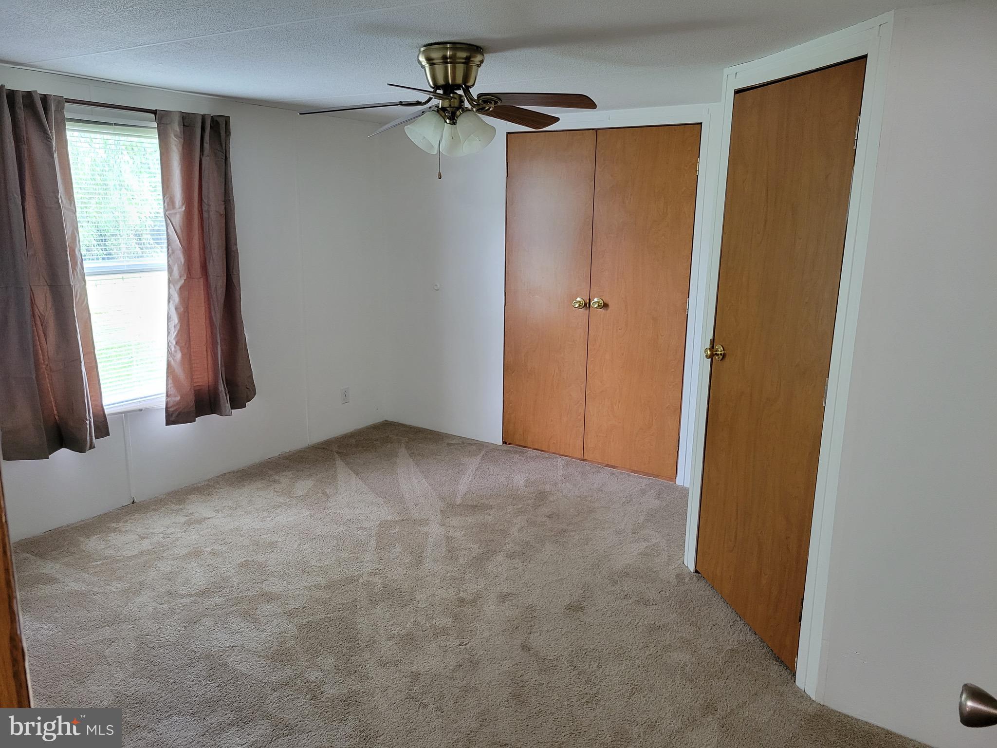 164 Jimtown Road Berkeley Springs, WV 25411 - Photo 12 of 15 a view of an empty room and a window