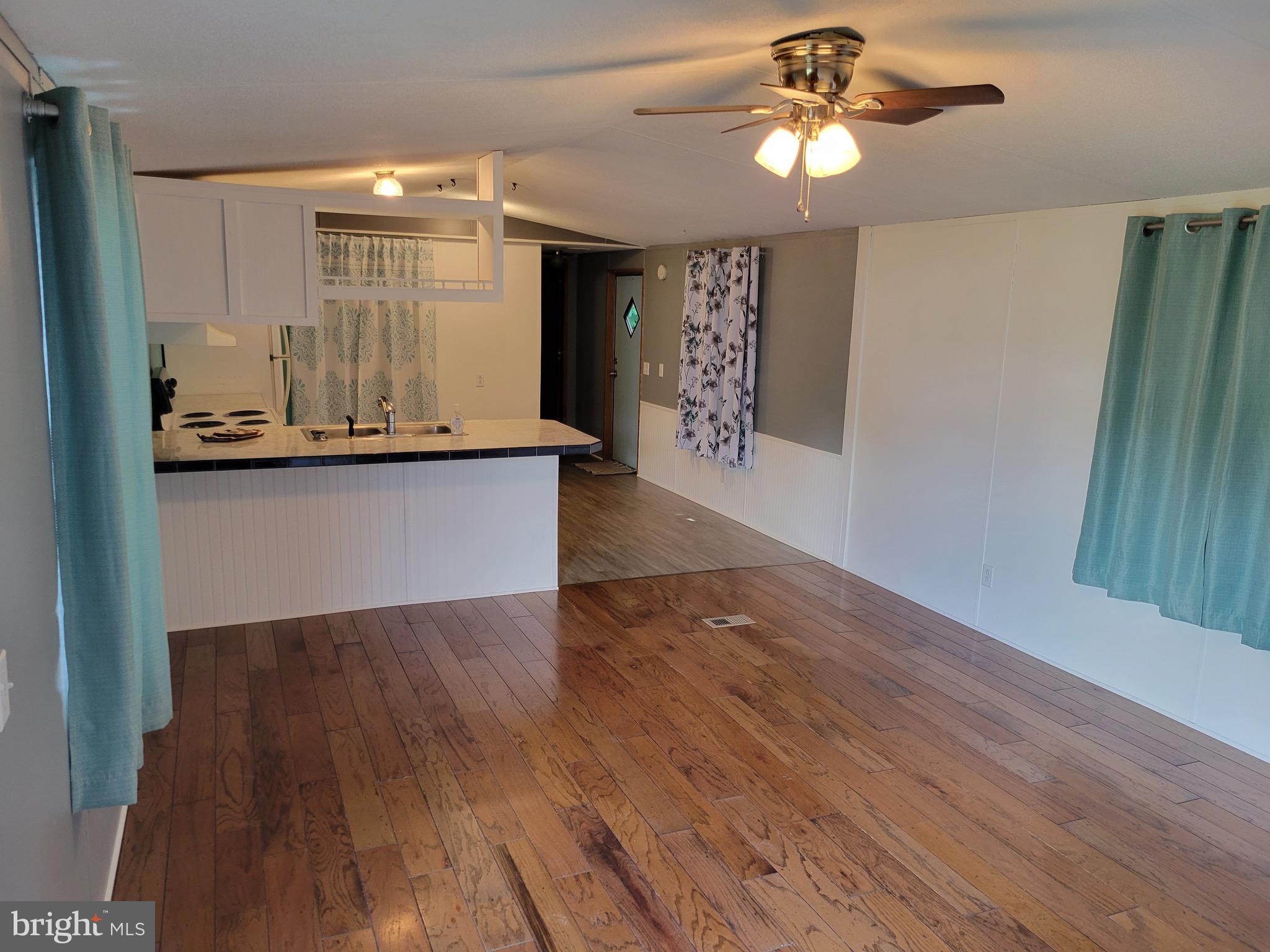 164 Jimtown Road Berkeley Springs, WV 25411 - Photo 7 of 15 a view of kitchen with granite countertop cabinets a sink and dishwasher