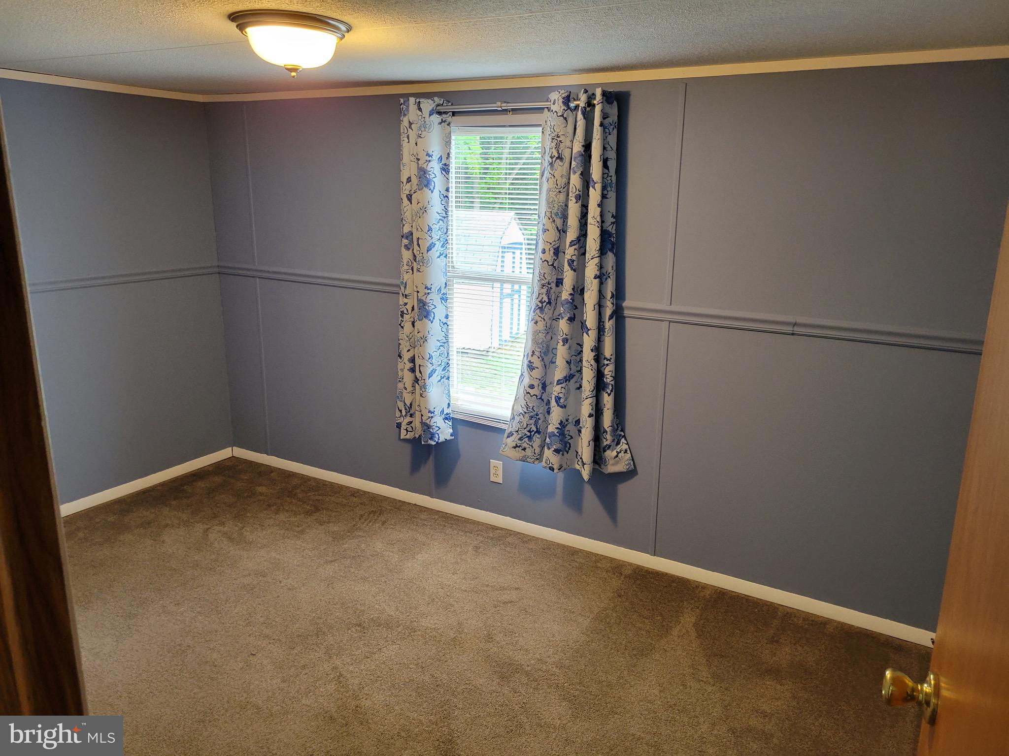 164 Jimtown Road Berkeley Springs, WV 25411 - Photo 10 of 15 a view of a room with window