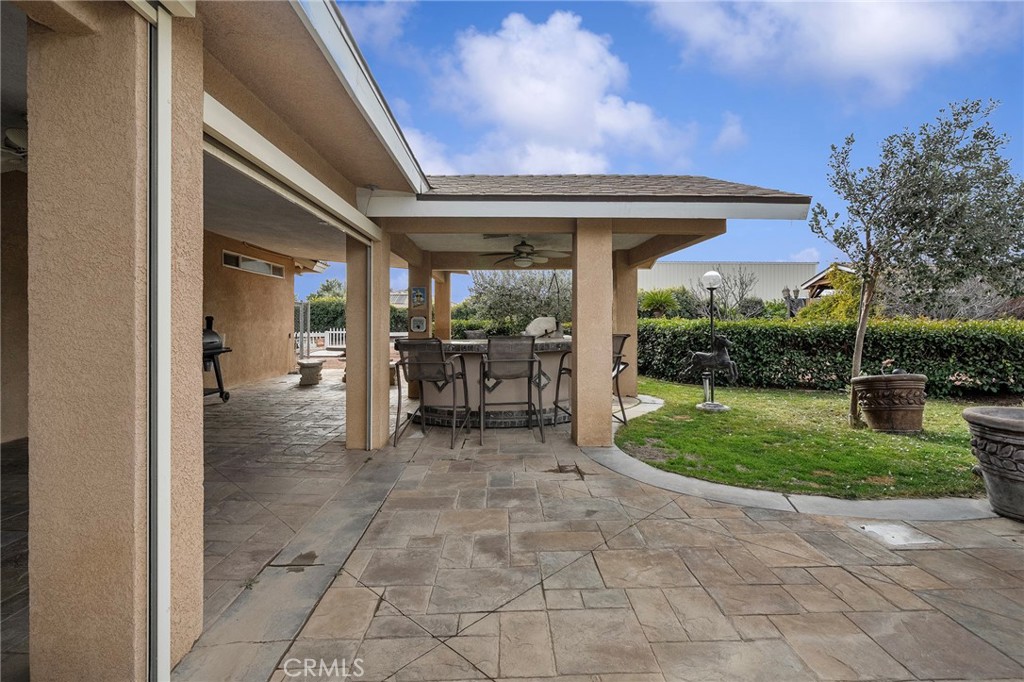 7172 Jargon Road Hesperia, CA 92344 - Photo 59 of 75 a view of a porch with chairs and backyard