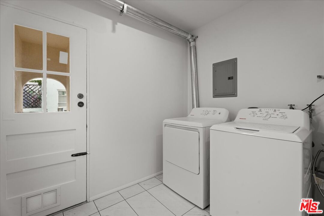 207 South Reeves Drive Beverly Hills, CA 90212 - Photo 13 of 13 a utility room with dryer and washer