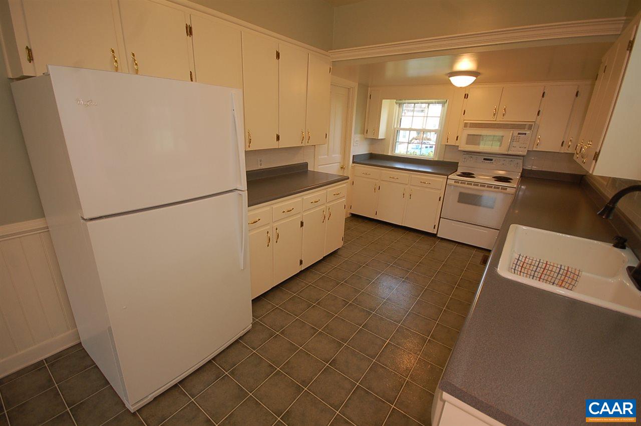32 Madison Road Stanardsville, VA 22973 - Photo 20 of 50 a white refrigerator freezer sitting inside of a kitchen