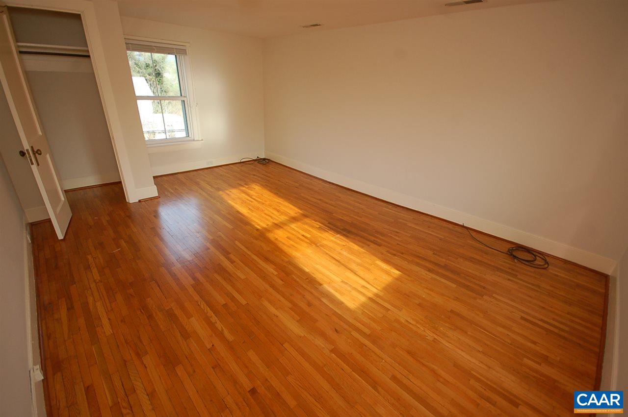 32 Madison Road Stanardsville, VA 22973 - Photo 27 of 50 a view of an empty room and wooden floor and a window