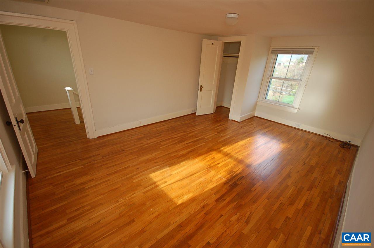 32 Madison Road Stanardsville, VA 22973 - Photo 28 of 50 an empty room with wooden floor and windows