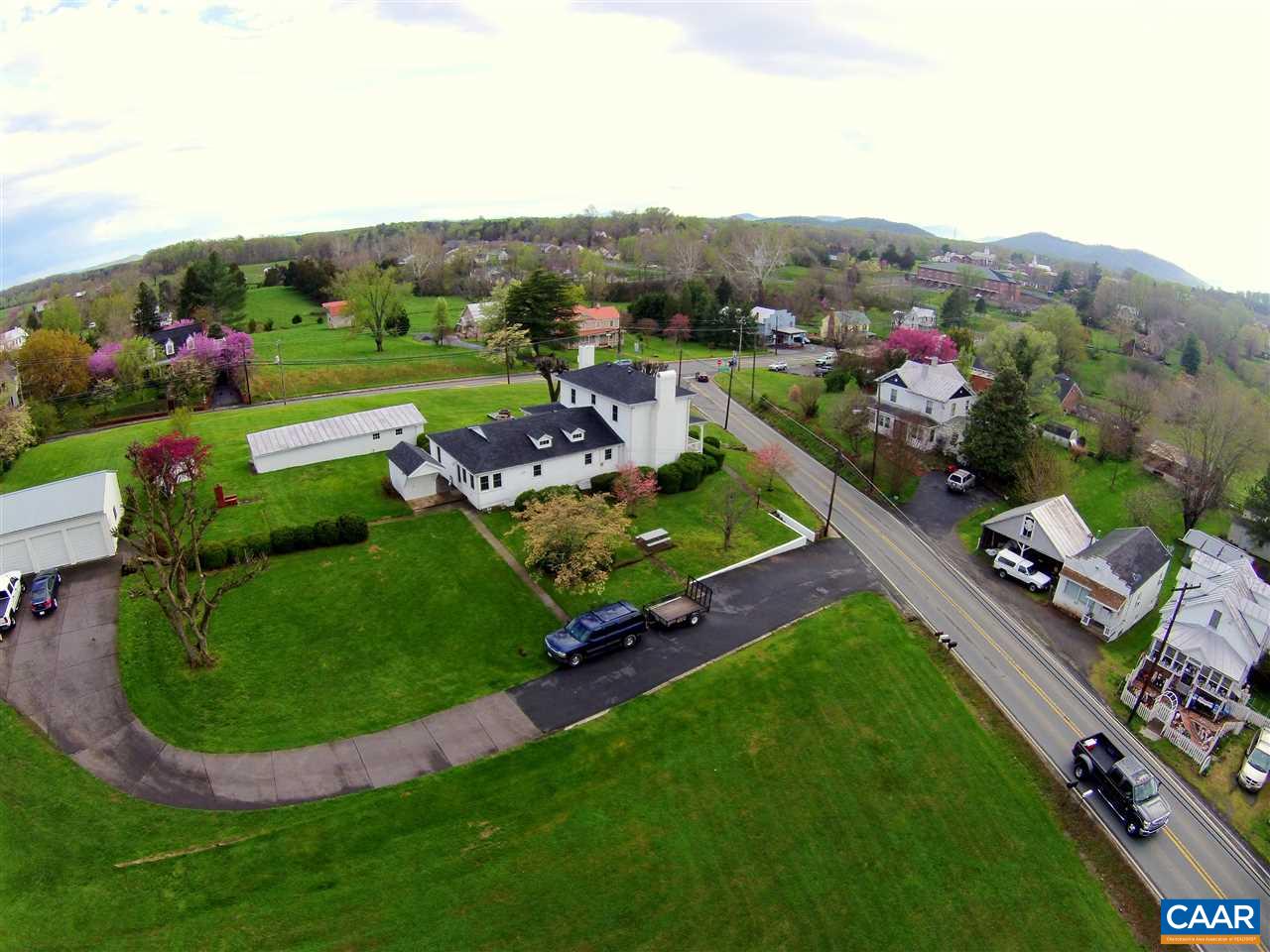 32 Madison Road Stanardsville, VA 22973 - Photo 3 of 50 an aerial view of a house with a garden and lake view