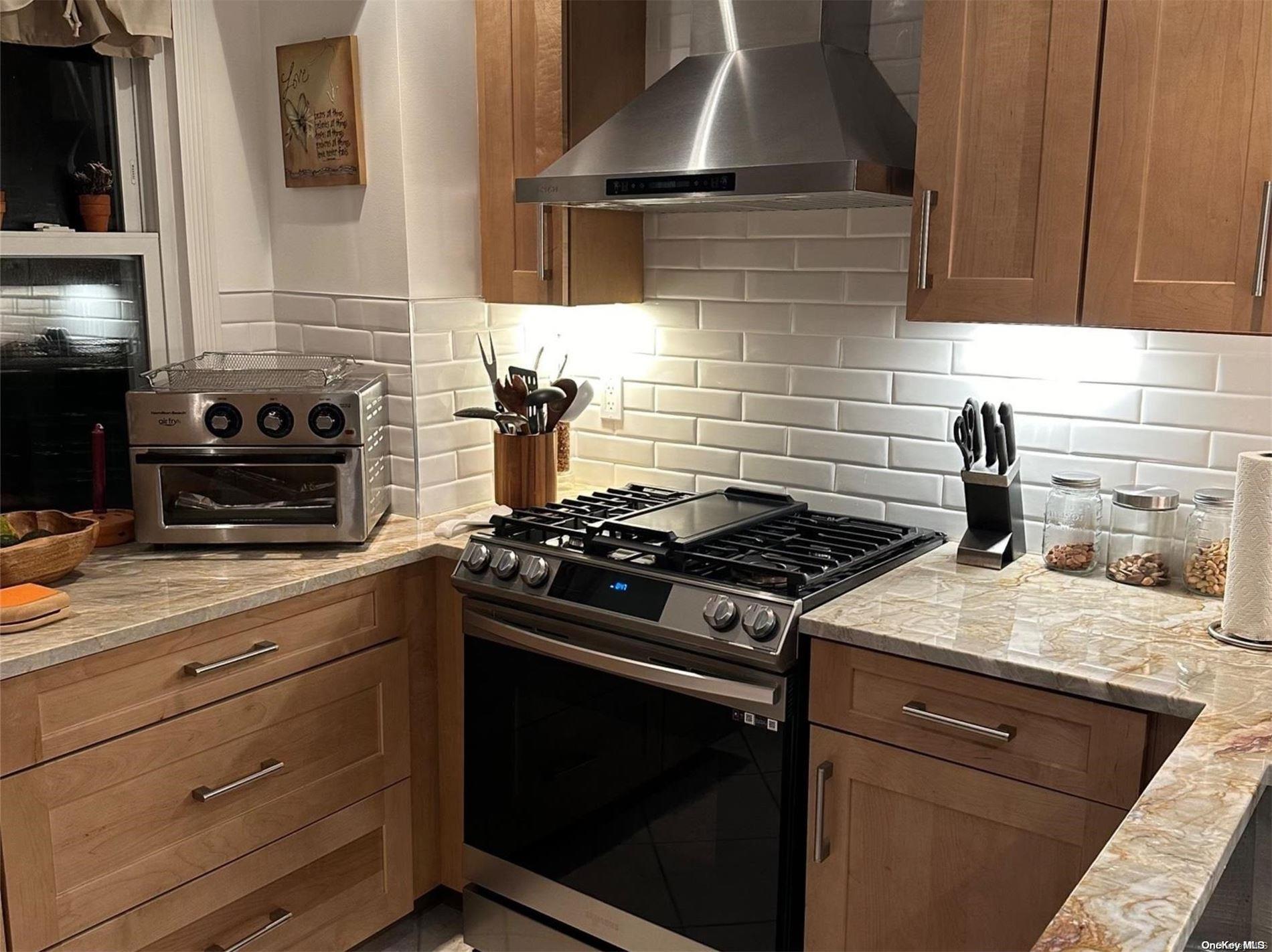 a kitchen with a stove and a microwave