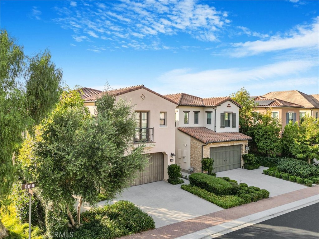 101 Omar Irvine, CA 92620 - Photo 1 of 42 a view of a white house with a big yard and large trees