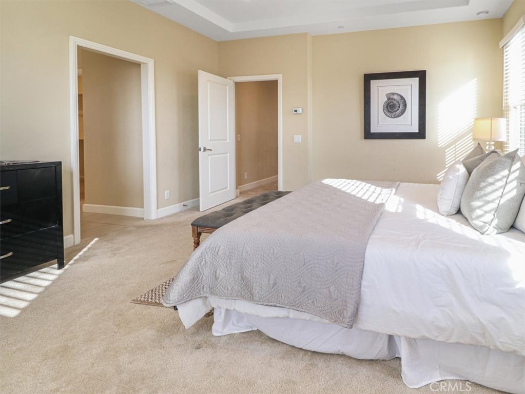 101 Omar Irvine, CA 92620 - Photo 33 of 42 a bedroom with a bed and a tv