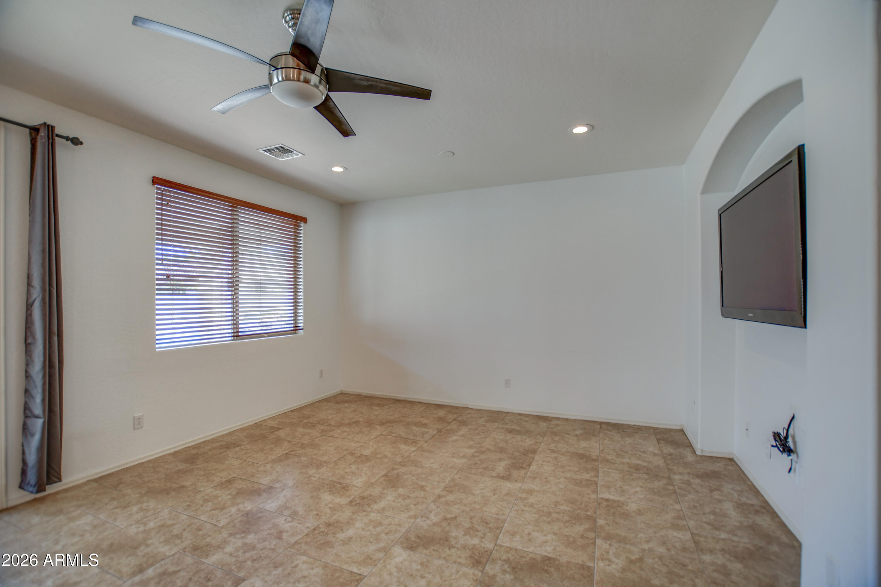 3078 East Muirfield Street Gilbert, AZ 85298 - Photo 25 of 92 a view of empty room with ceiling fan