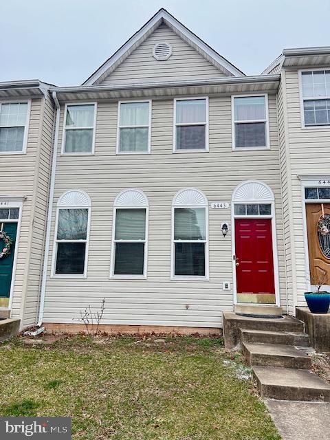 6443 McCoy Road Centreville, VA 20121 - Photo 1 of 28 Charming townhouse with vibrant red door.