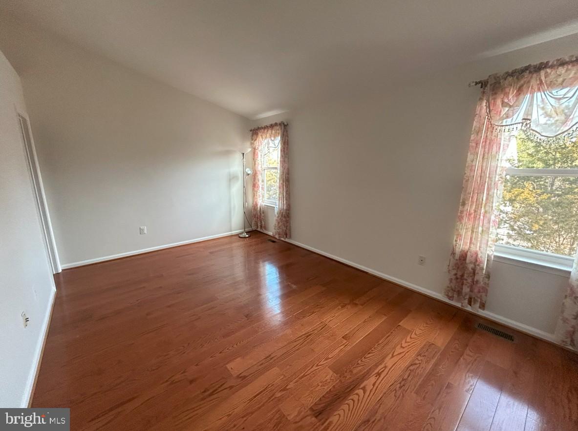 6443 McCoy Road Centreville, VA 20121 - Photo 11 of 28 Bright and airy space with warm wood floors.