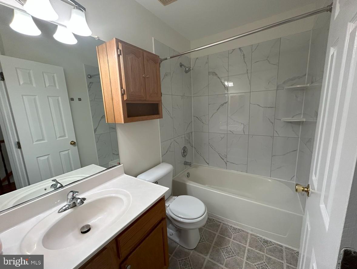 6443 McCoy Road Centreville, VA 20121 - Photo 13 of 28 Modern bathroom with elegant marble accents.