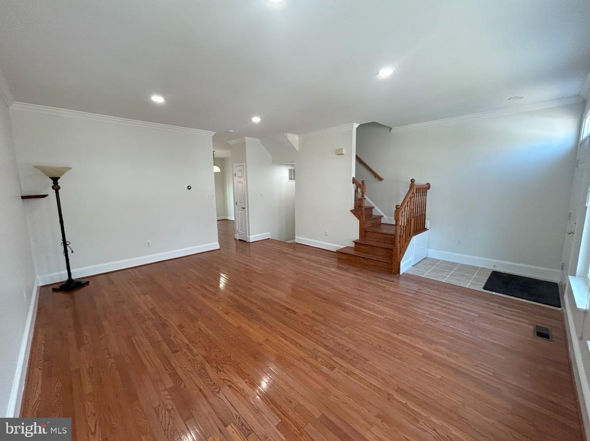 6443 McCoy Road Centreville, VA 20121 - Photo 2 of 28 Spacious living area with elegant hardwood floors.