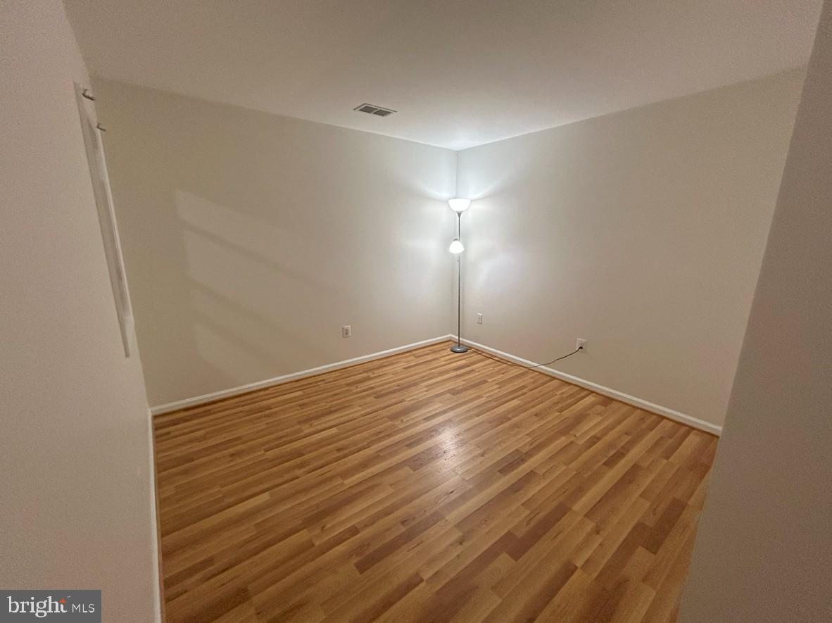 6443 McCoy Road Centreville, VA 20121 - Photo 23 of 28 Bright, spacious room with warm wood floors.