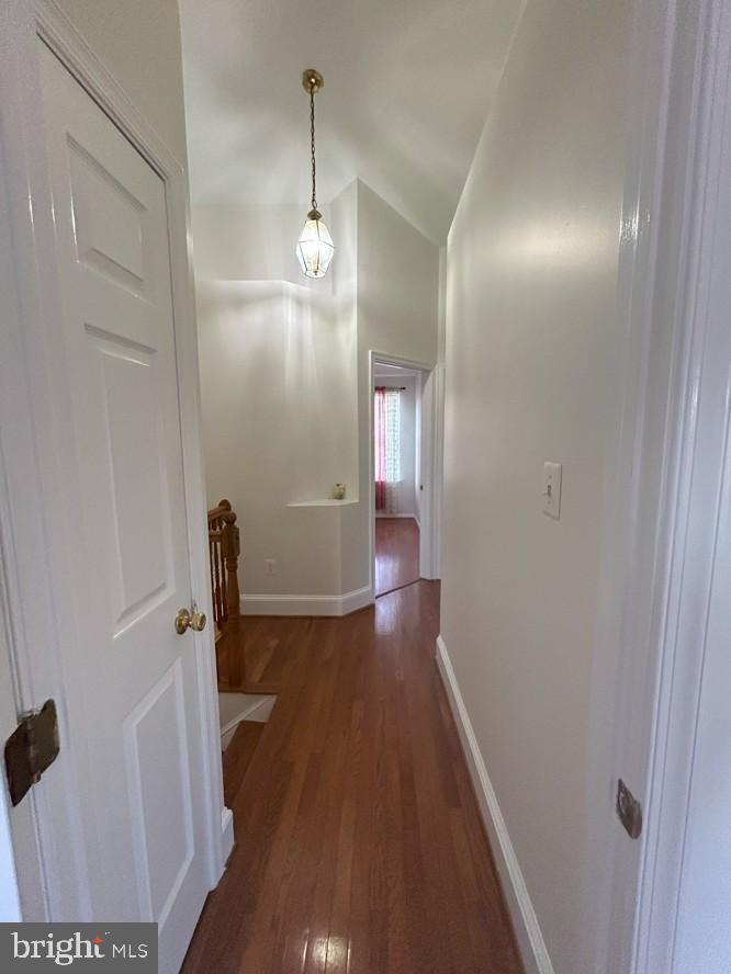 6443 McCoy Road Centreville, VA 20121 - Photo 10 of 28 Inviting hallway with warm wooden floors.